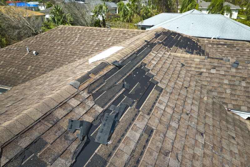 Damaged Shingles Being Replaced